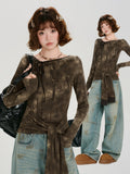 Collage showing a woman in a long-sleeve brown tie-front top with a tie-neck detail and acid wash effect, styled with wide-leg jeans.