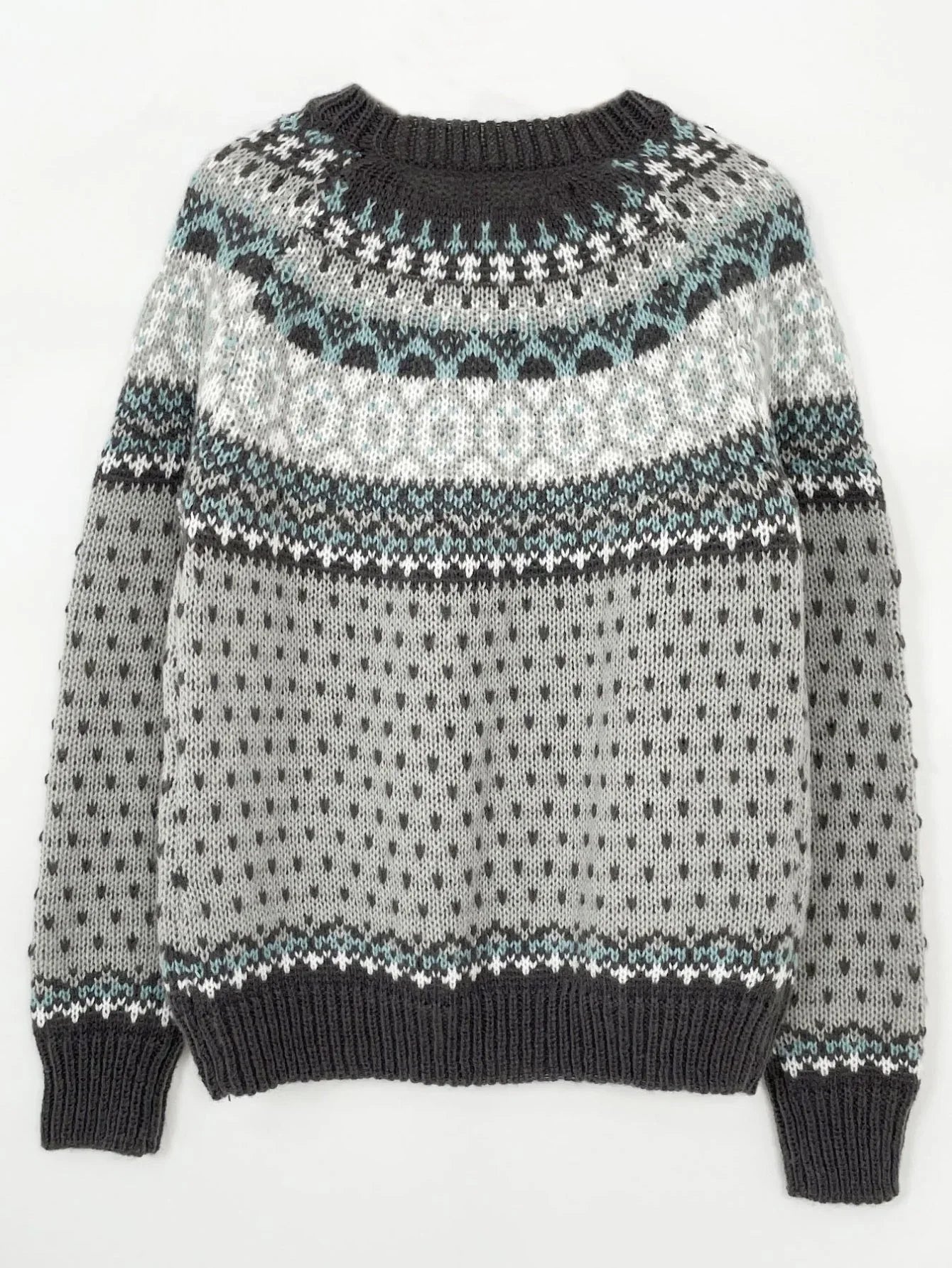 Grey and blue Fair Isle knit sweater laid flat