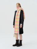 woman wearing purple and green plaid oversized wool blend scarf
