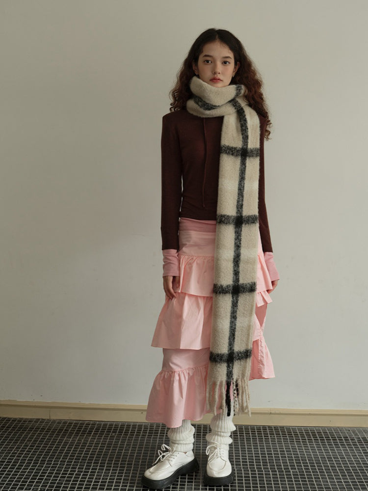 Full body shot of a model with a plaid scarf