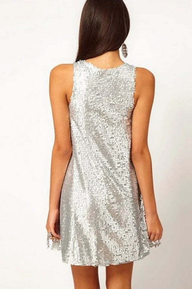 Woman wearing a silver sequined sleeveless A-line mini dress, back view