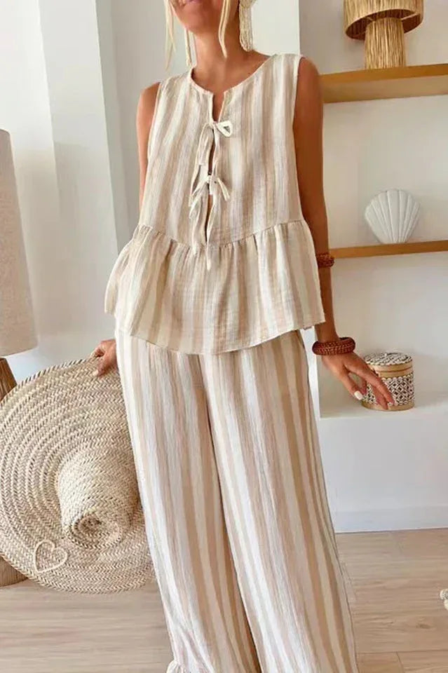 Close-up of the tie-front neckline on a striped peplum top