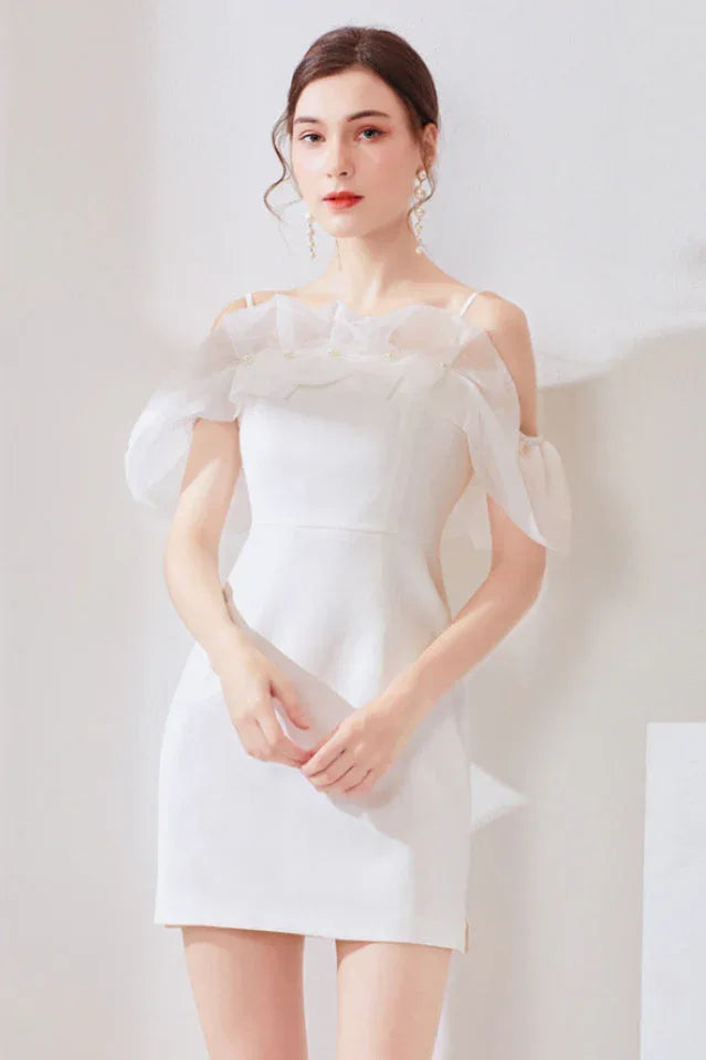 Woman wearing a white short sheath dress with ruffled off-the-shoulder sleeves Main image