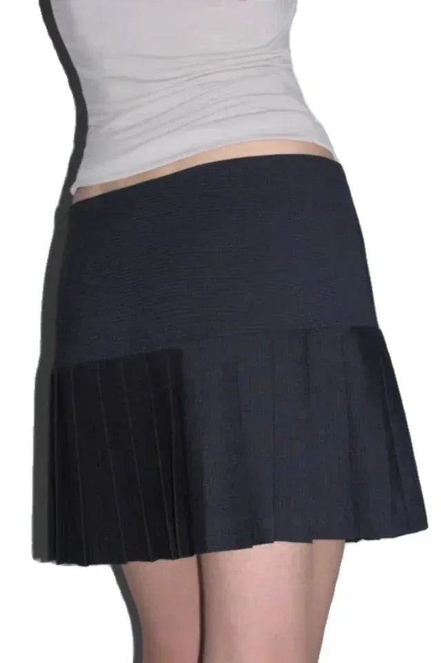 Side view of a black pleated mini skirt with a high waist and A-line silhouette.
