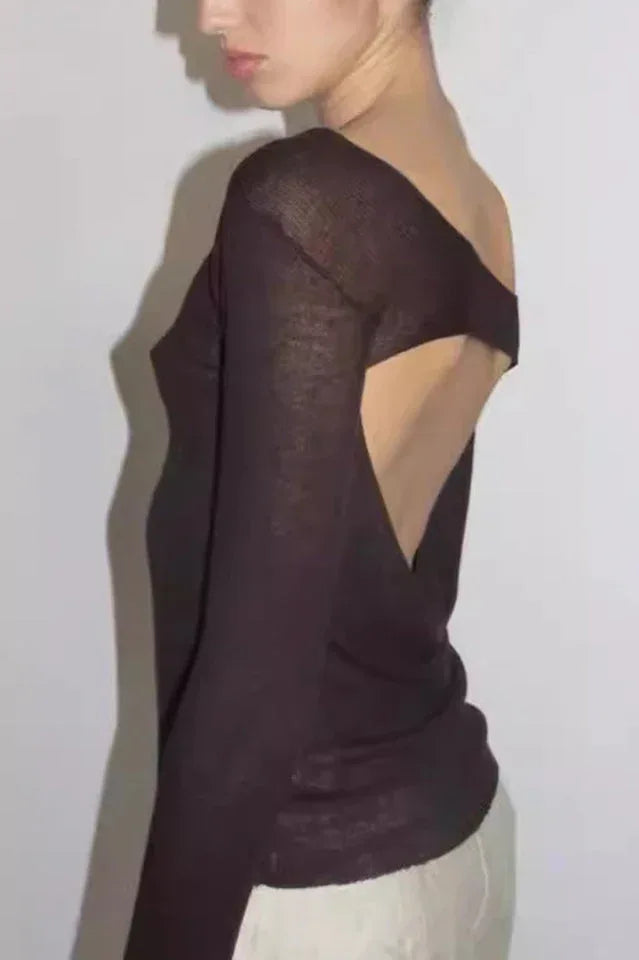 Side view of a dark brown sheer long-sleeve top with an asymmetrical neckline and an open back detail.