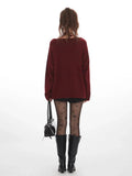 back view of a burgundy long sleeve knit sweater