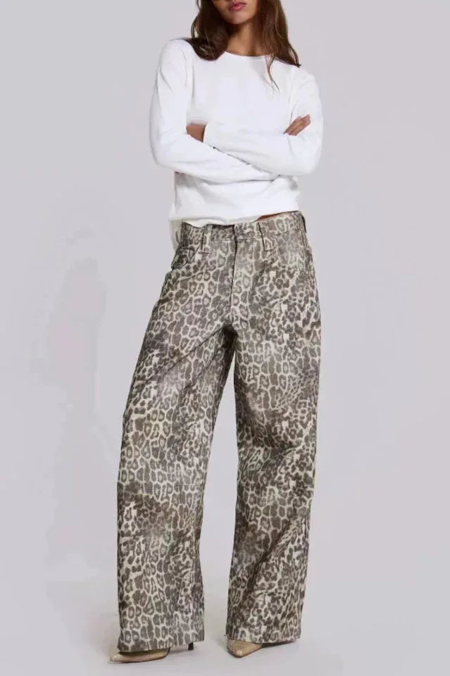 Model wearing leopard print wide leg jeans and a white long-sleeve shirt. Main image