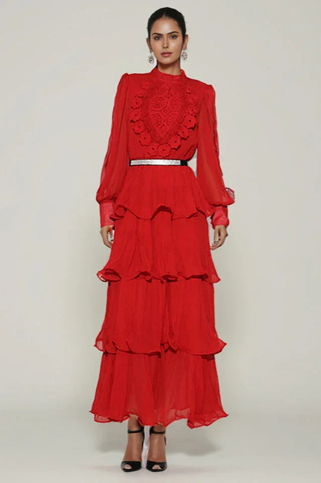 Woman wearing a red tiered chiffon maxi dress with lace detail and balloon sleeves Main image