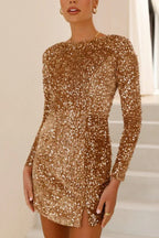Side view of a gold sequin mini dress with long sleeves and a tie detail