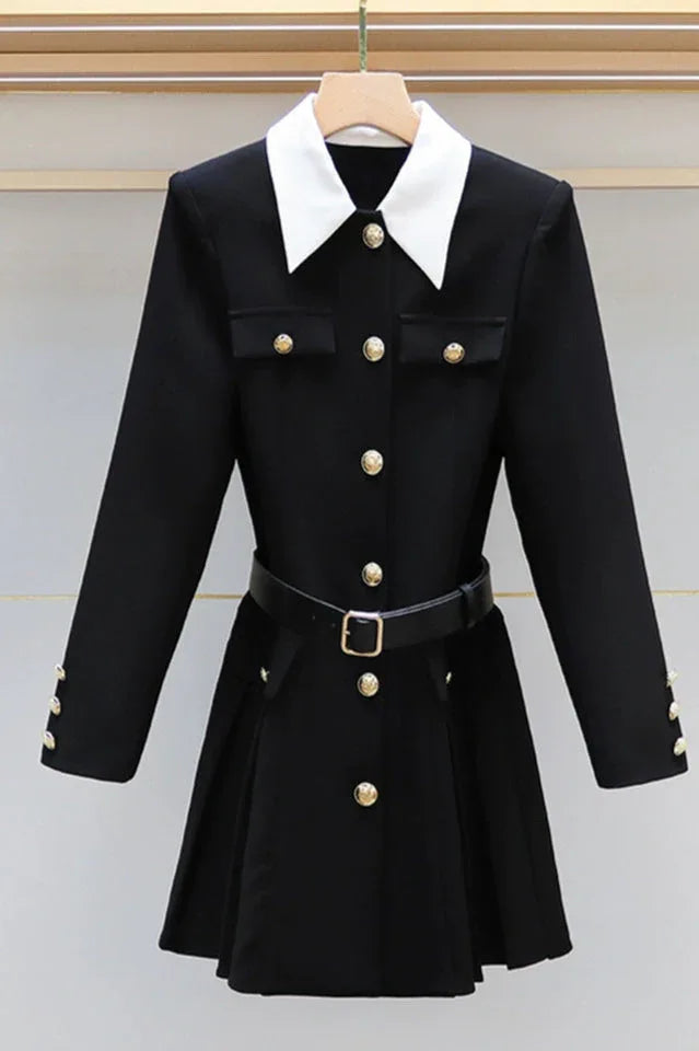 black dress with white collar and gold buttons displayed