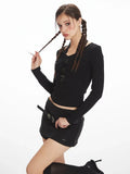 model posing in black fitted long sleeve top
