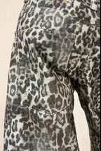 Rear view of leopard print wide leg jeans showing back pockets.