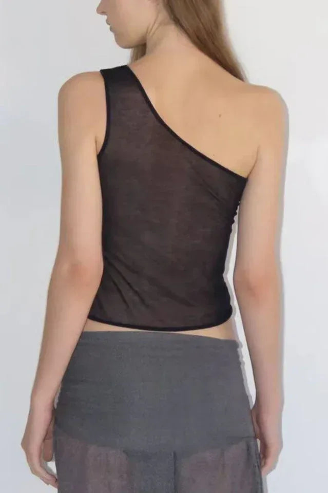 Back view of a woman in a black asymmetric one shoulder top