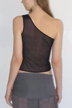 Back view of a woman in a black asymmetric one shoulder top