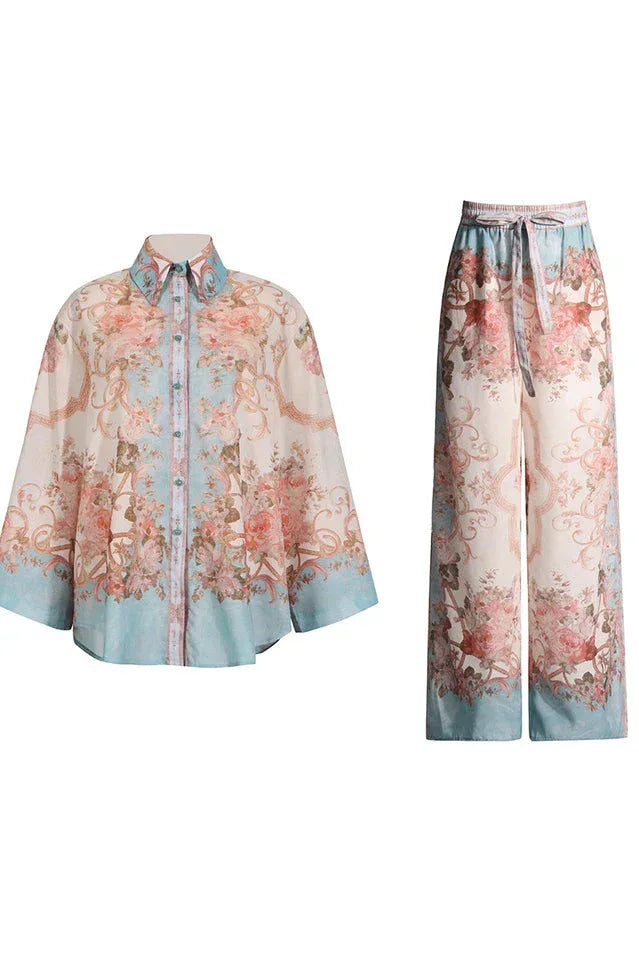 Light blue and pink floral print matching set with a button-down shirt and wide-leg pants.