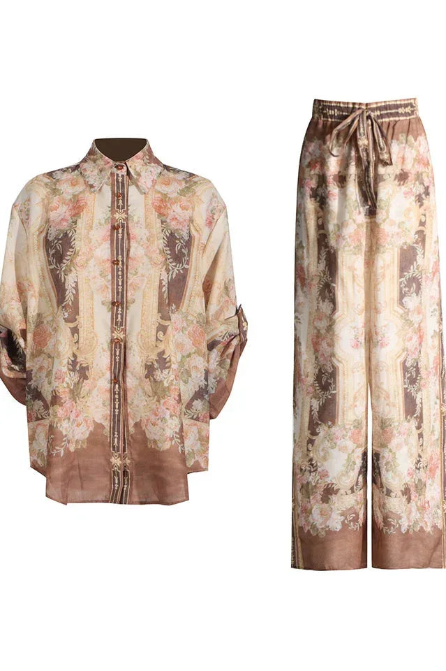 Brown and pink floral print matching set consisting of a button-down shirt and wide-leg pants.