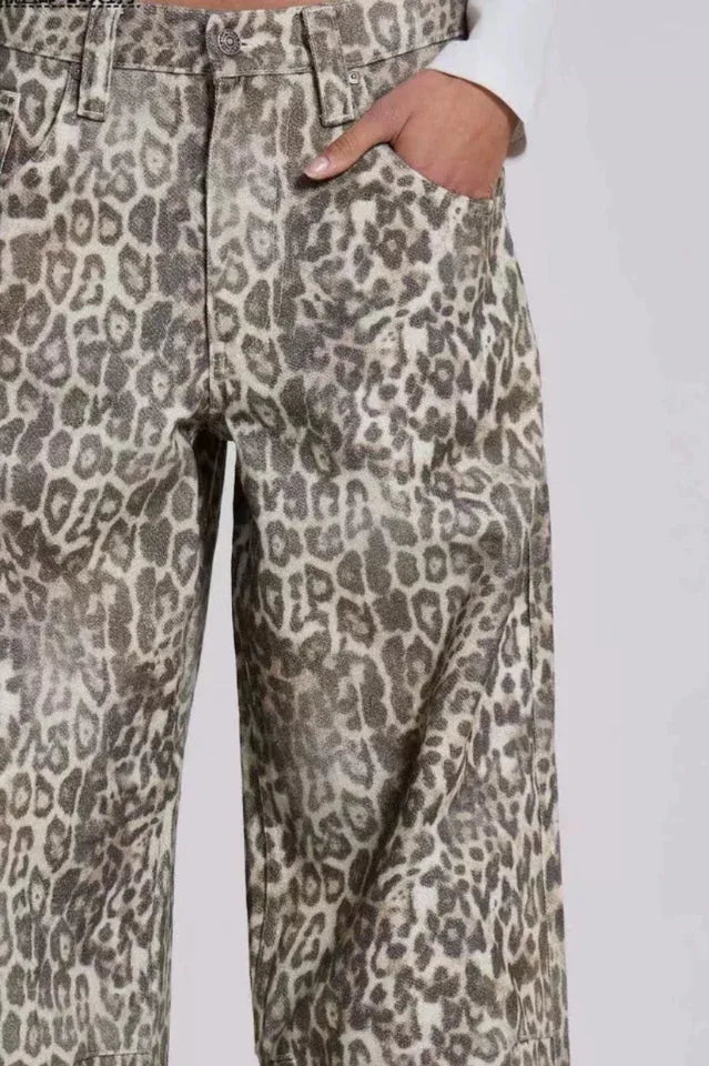 Detail of the pockets on leopard print wide leg jeans.