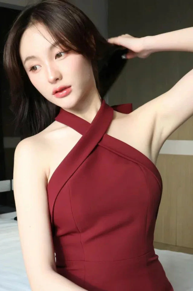 Close-up of the red halter neck detail on a mini dress
