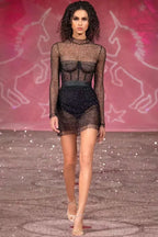 Studio shot of a black embellished mesh mini dress
