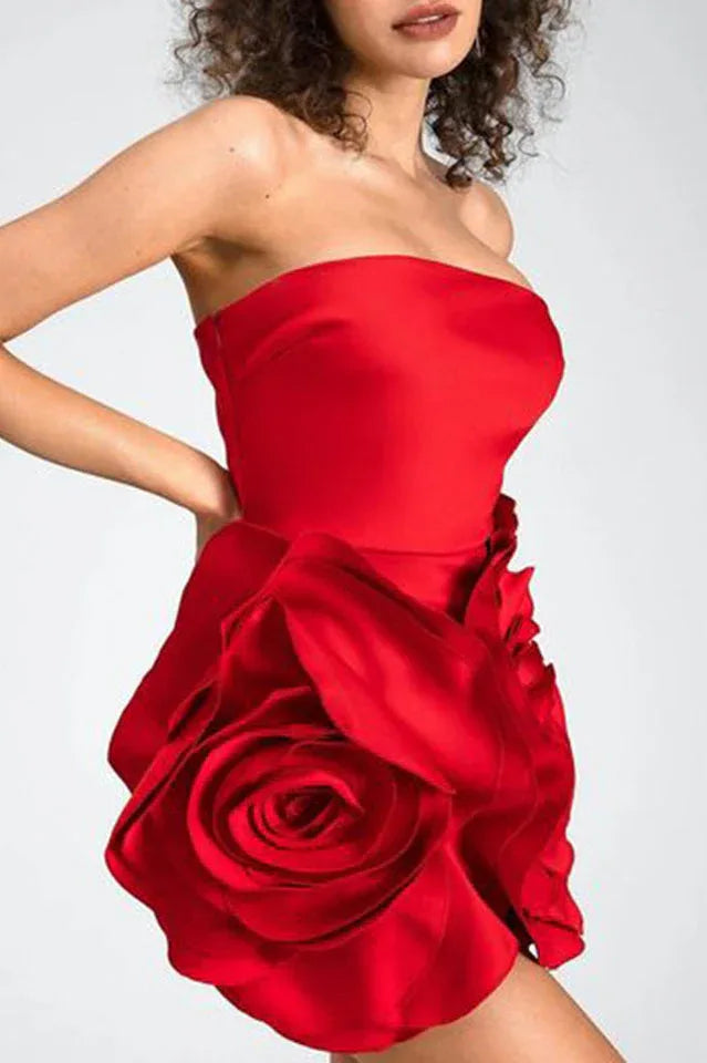 Close-up of the 3D rose applique on a red strapless dress