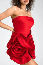 Close-up of the 3D rose applique on a red strapless dress