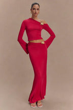 Close-up of the floral embellishment on the hip of the red skirt.