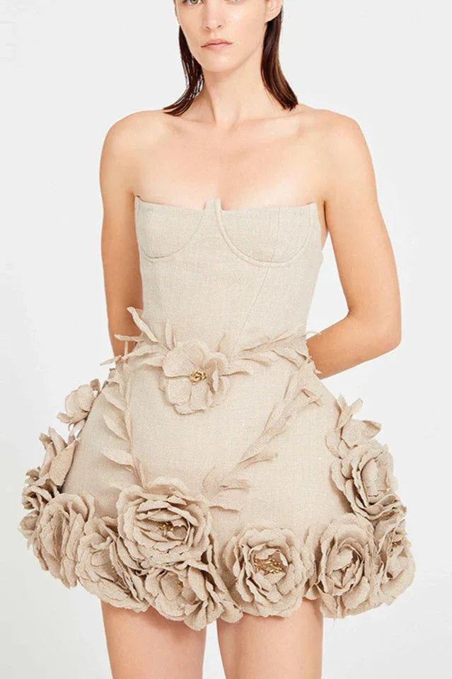 Woman in a cream corset dress with lace-up detail and flared skirt