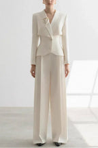 Ivory formal pantsuit with asymmetric lapel and peplum waist