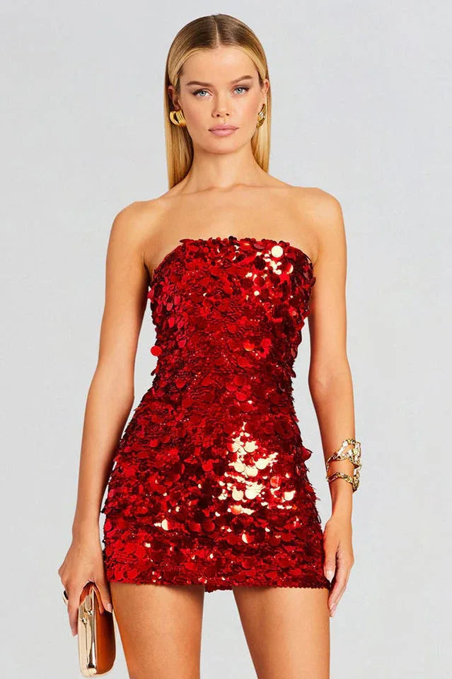 Woman wearing a red sequined strapless mini dress