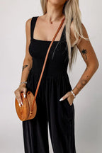 Detail of the side pockets on a black wide leg jumpsuit