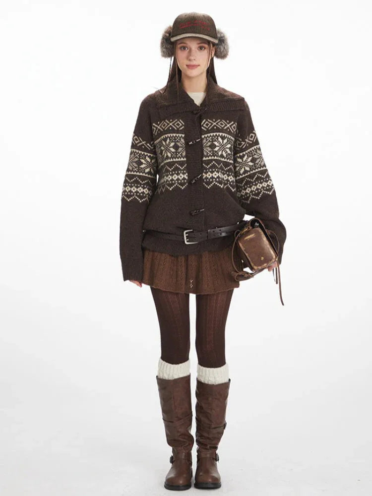 Woman wearing a brown Fair Isle knit cardigan with toggle closures and a fold-over collar.