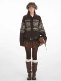 Woman wearing a brown Fair Isle knit cardigan with toggle closures and a fold-over collar.