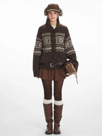 Woman wearing a brown Fair Isle knit cardigan with toggle closures and a fold-over collar.