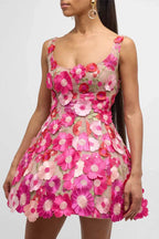 Woman wearing a pink floral embroidered mini dress from the front