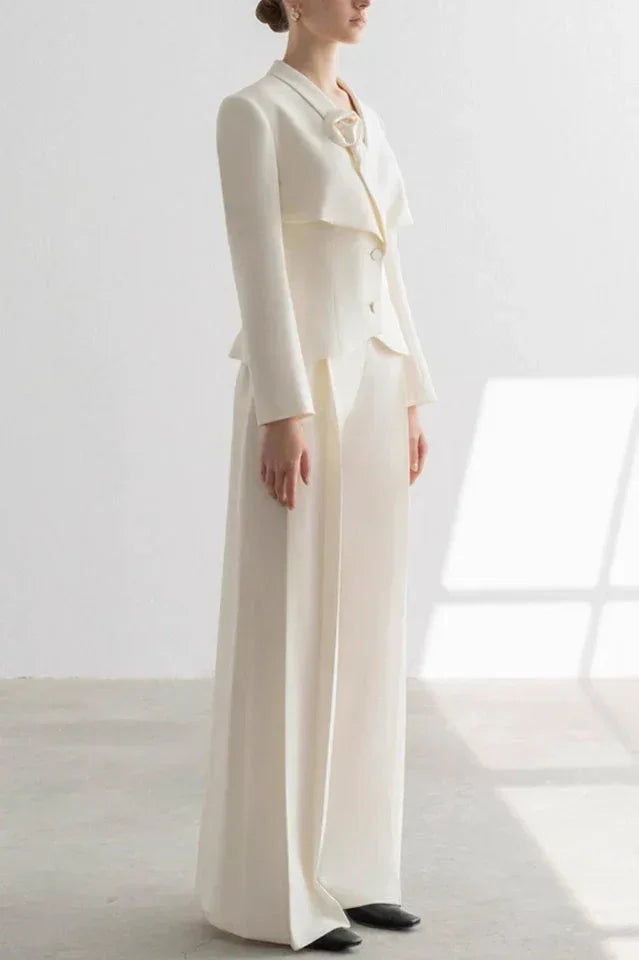 White tailored pantsuit with wide-leg trousers and structured jacket