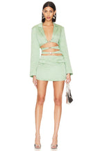 Close-up of the hardware detail on a cut out blazer dress