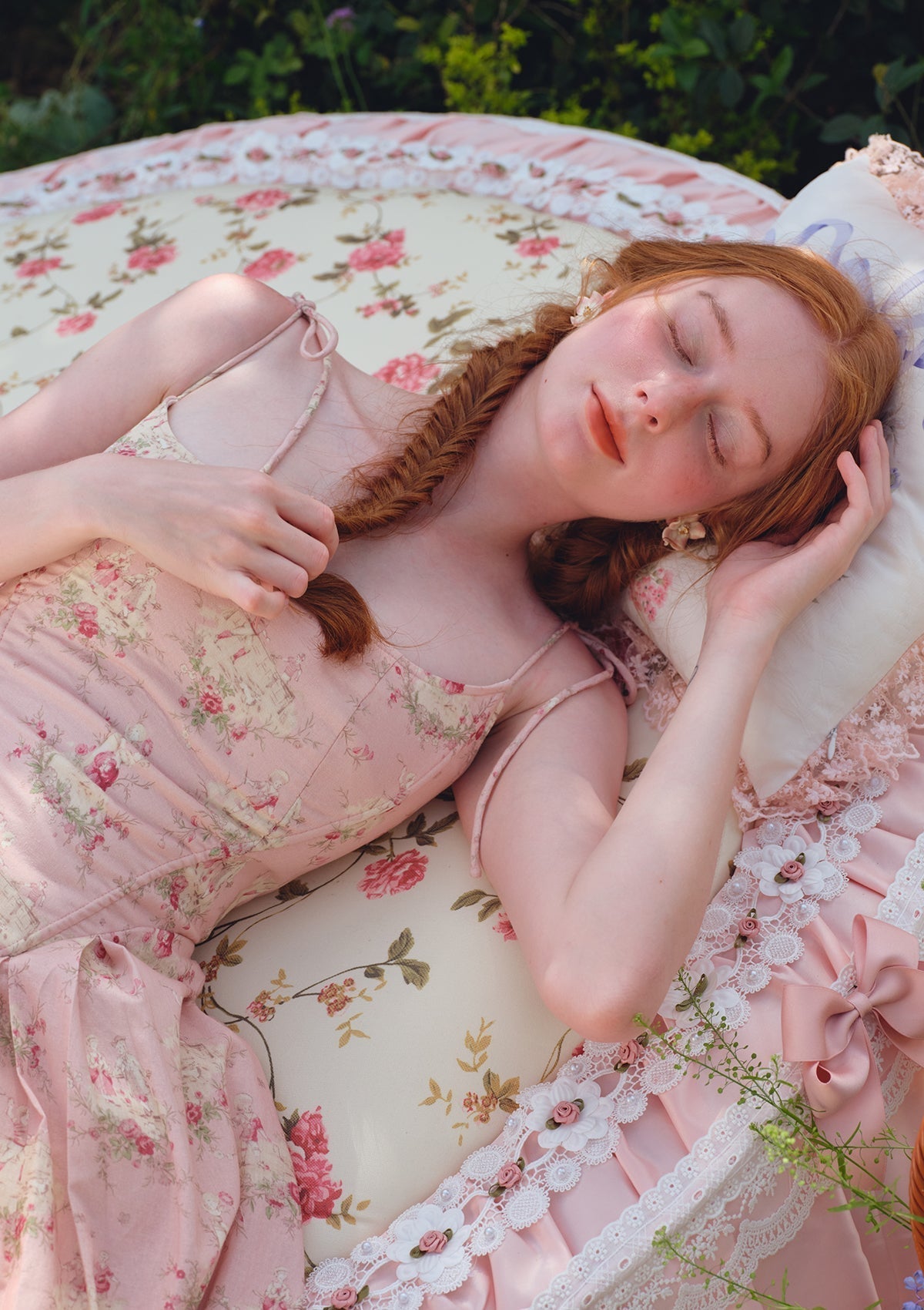 Close-up of the floral print on a pink midi dress.