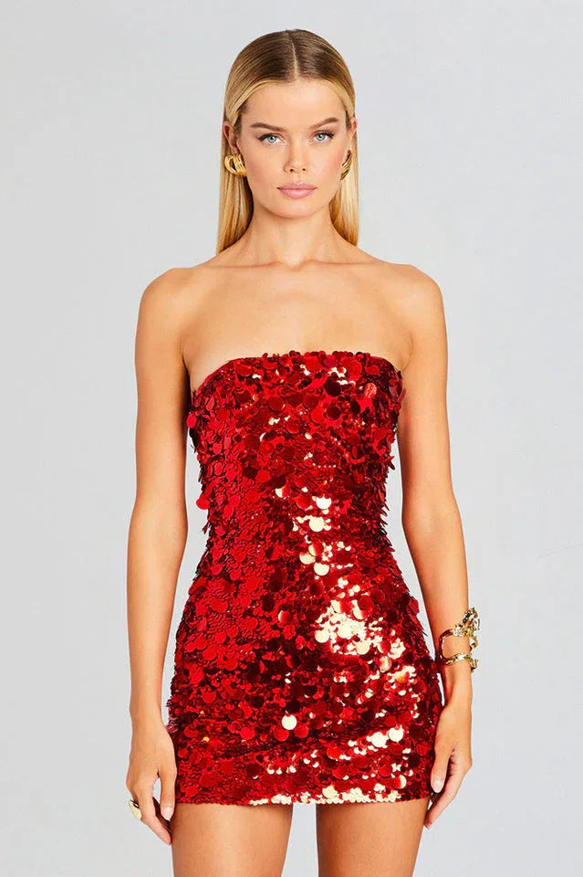 Front view of a woman in a red sequined strapless dress