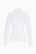 White long-sleeved top on a mannequin