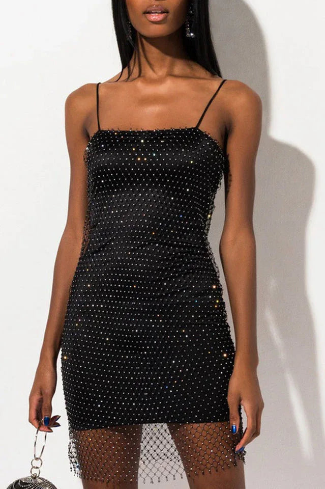 Model wearing a black sparkle mini dress with spaghetti straps Main image