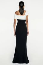 Close-up of the draped neckline detail on a black and white formal gown