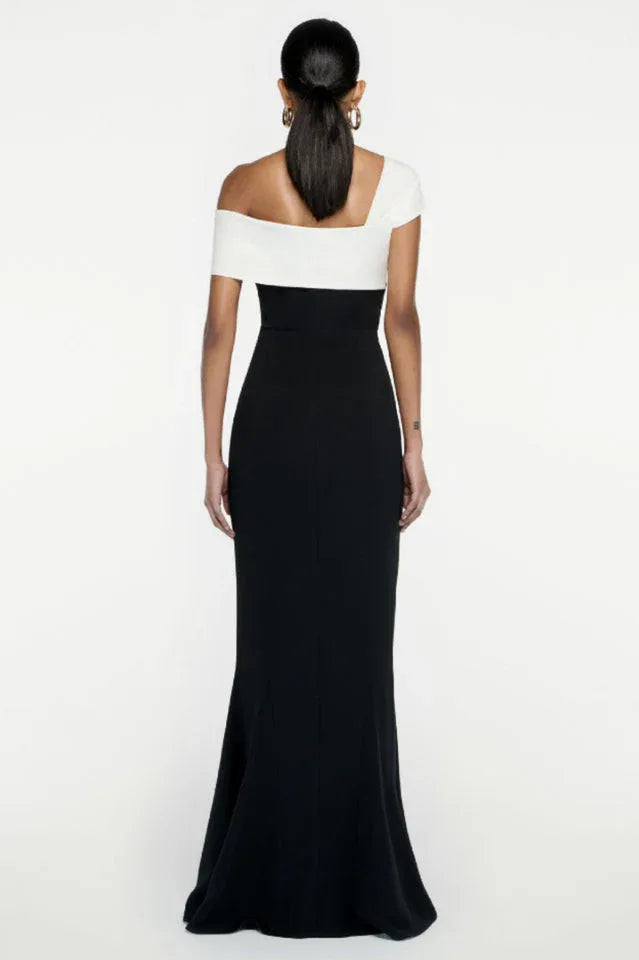 Close-up of the draped neckline detail on a black and white formal gown