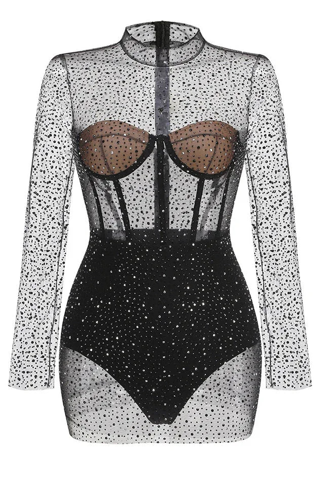 Detailed view of the structured bodice on a black mesh dress
