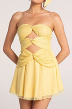 Yellow strapless ruched chiffon mini dress with cut-out details and crystal embellishments