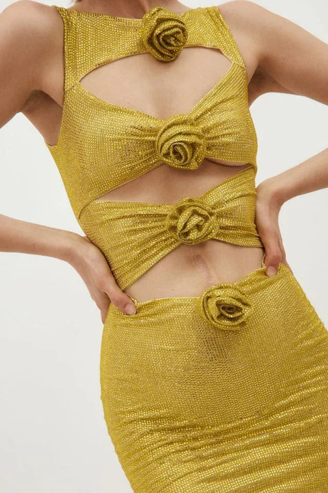 Back view of a gold metallic knit mini dress with a center back zipper
