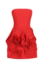 Red strapless dress with floral skirt detail on a white background