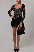 Side profile of a woman showcasing the details of a black lace corset dress.