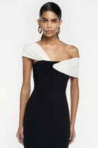 Full length studio shot of a black and white formal gown with a mermaid hem
