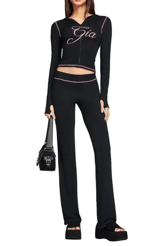 Black long-sleeve jacket with pink embroidery and thumbholes