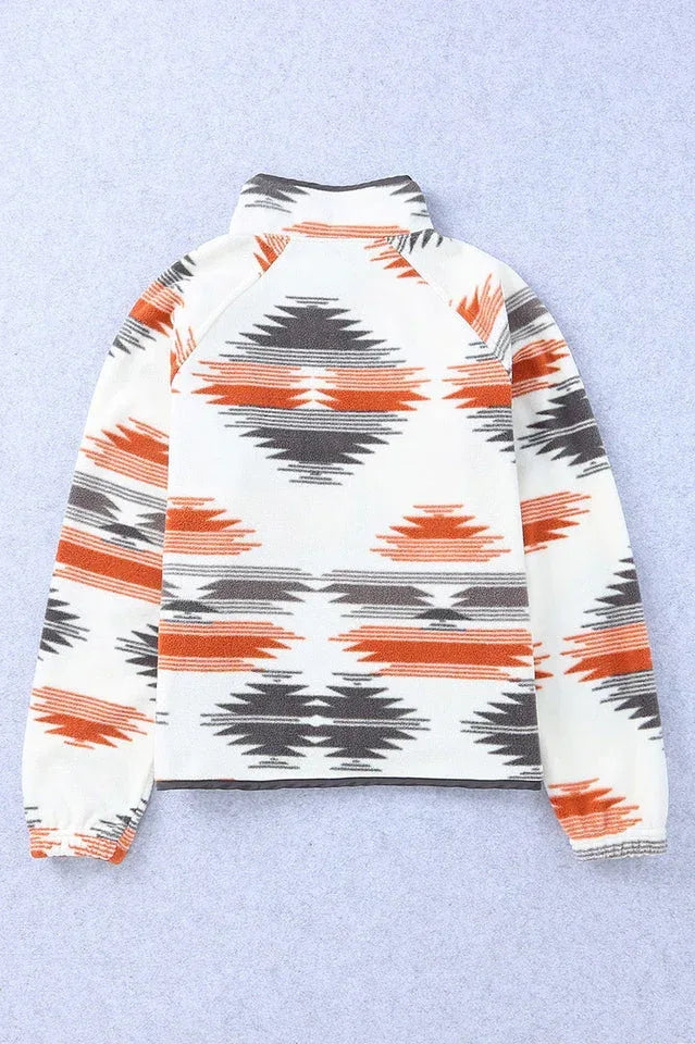 Back view of a cream fleece jacket with an orange, black, and grey geometric print, displayed flat.